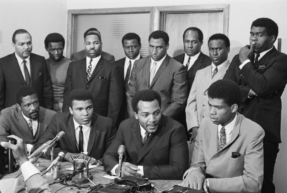 Front row: Bill Russell, Muhammad Ali, Jim Brown and Kareem Abdul-Jabbar. Back row (left to right): Dem. Rep. Carl Stokes, Browns player Walter Beach, Redskins player Bobby Mitchell, Browns player Sid Williams, Cleveland Browns; Chiefs player Curtis McClinton, Packers player Willie Davis, and Browns players Jim Shorter and John Wooten. (Getty Archive)