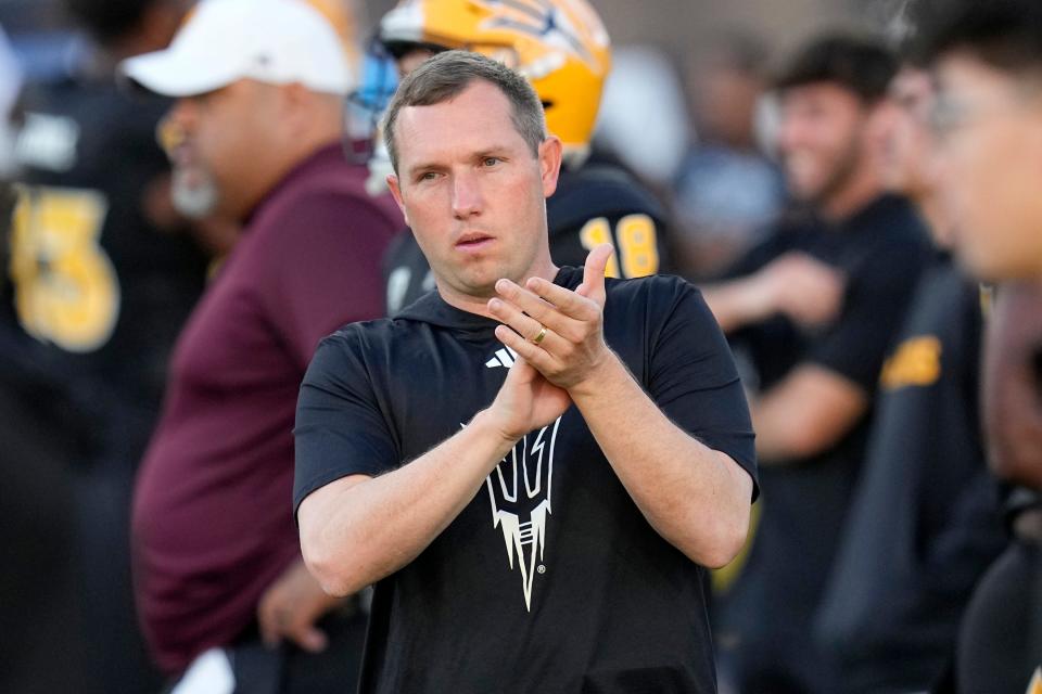 Arizona State head coach Kenny Dillingham applauds his players as they warm up prior to an NCAA college football game against Washington State Saturday, Oct. 28, 2023, in Tempe. (AP Photo/Ross D. Franklin)