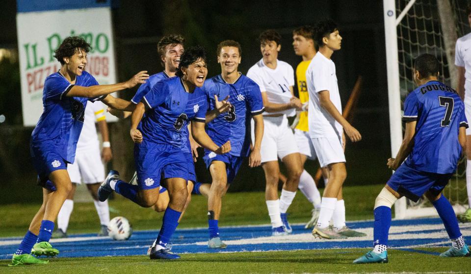 Javier Gomez #6, center, of the Barron Collier boys soccer team celebrates a goal over Naples in the CCAC Championships at Barron Collier onFriday, Jan. 5, 2024.