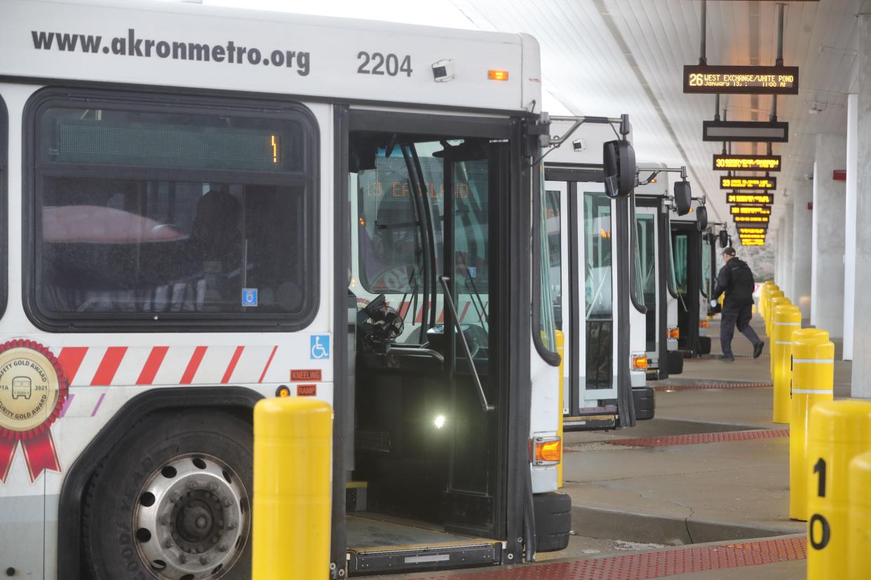 A driver heads to his bus Friday at the Robert K. Pfaff Transit Center on South Broadway in Akron. Metro RTA plans major changes beginning June 4.