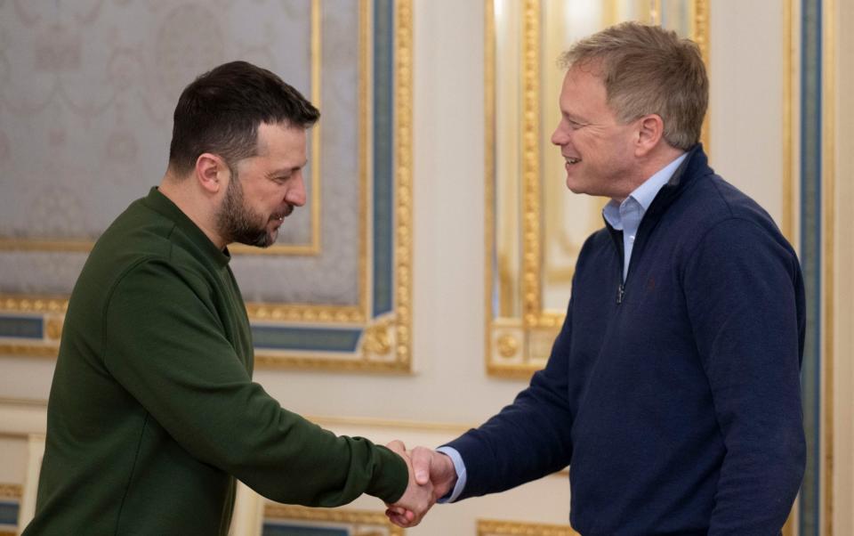 Volodymyr Zelensky, left, shakes hands with Grant Shapps, the British defence secretary, in Kyiv