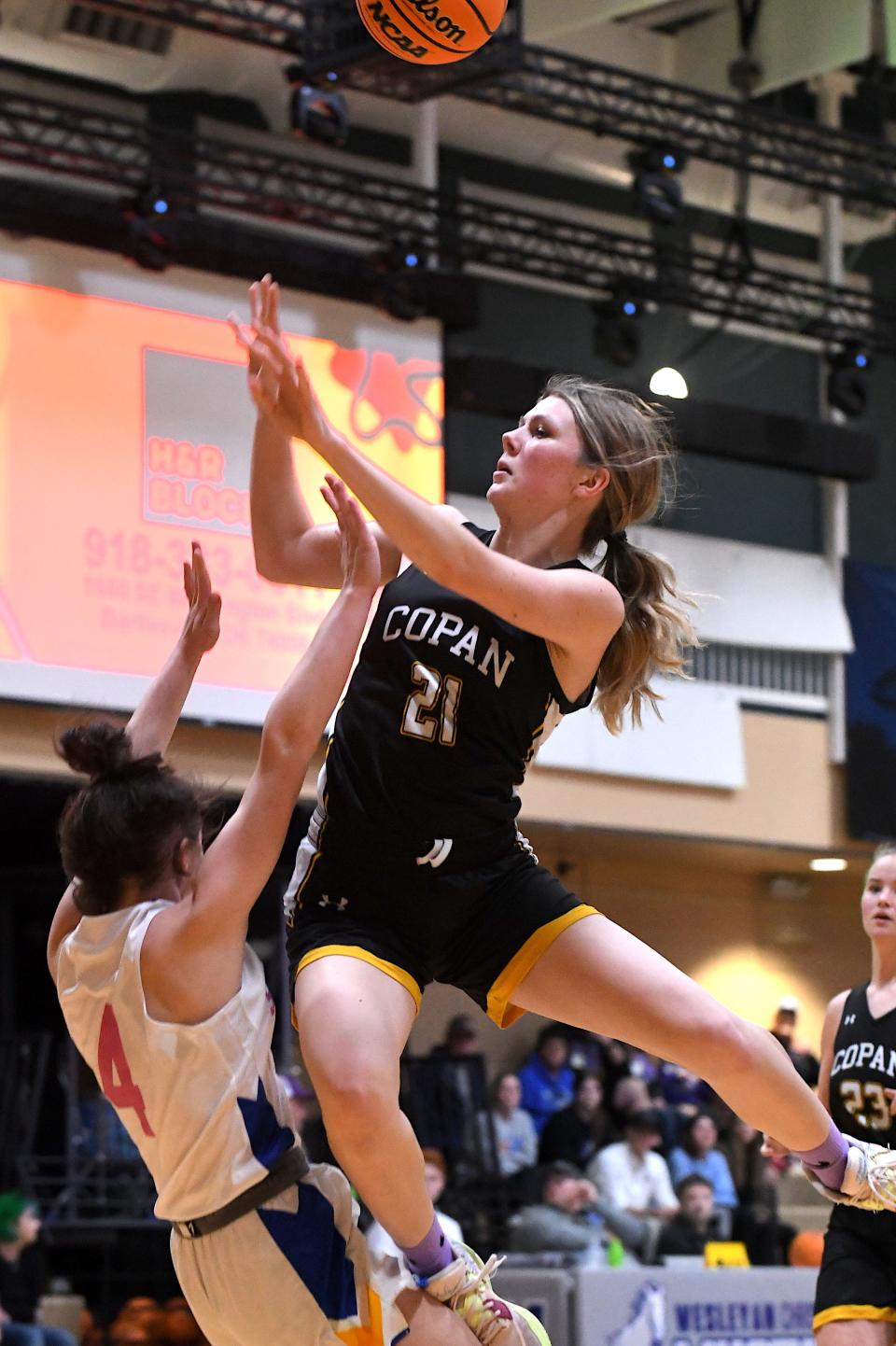 Copan High School's Elzabeth Odum (21) scores against Shidler in playoff championship action at Wesleyan Christian School in Bartlesville on Feb. 10, 2024.