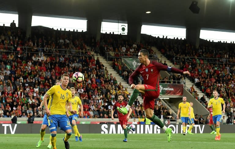 Portugal's forward Cristiano Ronaldo goes for the ball during the friendly football match Portugal vs Sweden at the Estadio dos Barreiros in Funchal on March 28, 2017