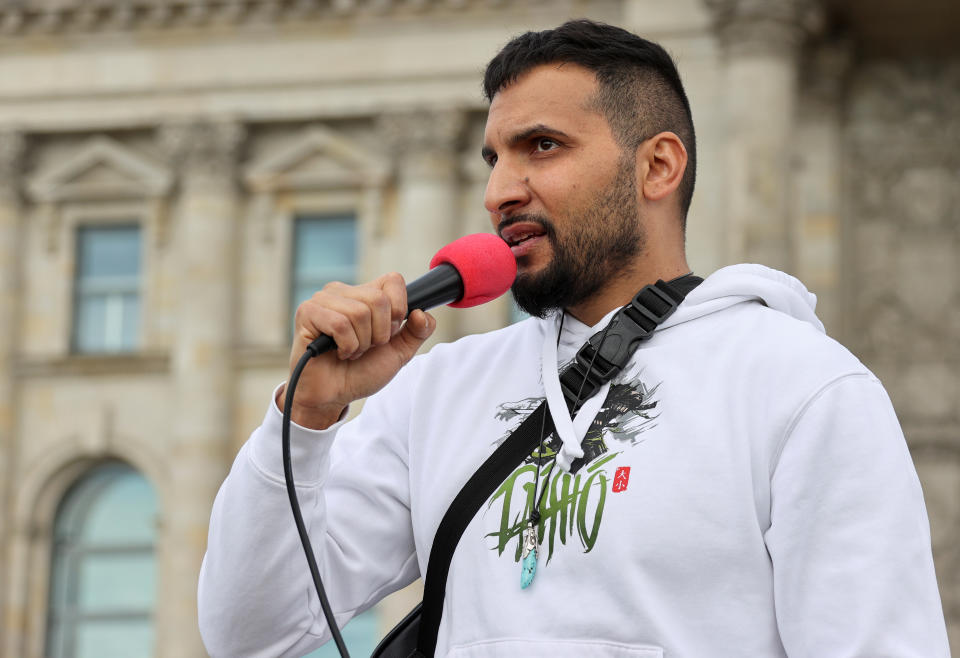 Attila Hildmann, the organizer of the demonstration, speaks during a protest against the government's restrictions following the coronavirus disease (COVID-19) outbreak, in front of Reichstag, in Berlin, Germany May 16, 2020. REUTERS/Fabrizio Bensch