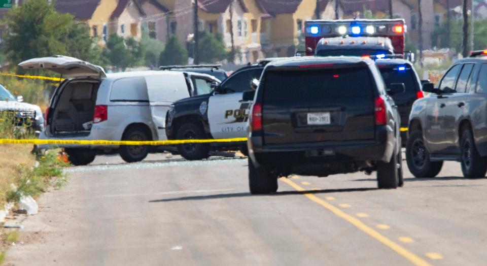 Odessa and Midland police and sheriff's deputies surround a white van in Odessa, Texas, Saturday, Aug. 31, 2019, after reports of gunfire. 