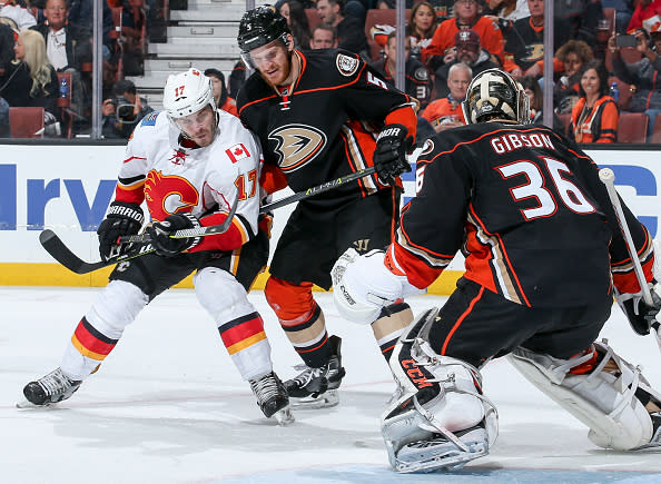 ANAHEIM, CA - APRIL 4: Lance Bouma #17 of the Calgary Flames competes with Korbinian Holzer #5 of the Anaheim Ducks for position in front of Ducks goalie John Gibson #36 during the second period of the game at Honda Center on April 4, 2017 in Anaheim, California. (Photo by Debora Robinson/NHLI via Getty Images) ***Local Caption ***