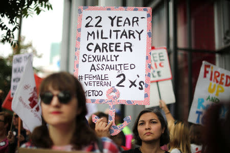 Arlene Rios, 40, who said she was sexually assaulted twice while in the U.S. Navy, participates in a protest march for survivors of sexual assault and their supporters in Hollywood, Los Angeles, California U.S. November 12, 2017. REUTERS/Lucy Nicholson