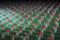 FILE - In this July 26, 2013, file photo, North Korean children perform at the May Day stadium during the "Arirang" mass games song-and-dance ensemble on the eve of the 60th anniversary of the Korean War armistice in Pyongyang, North Korea. North Korea is bringing back one of its most iconic art forms - mass games performed by tens of thousands of people working in precise unison - to mark its 70th anniversary on Sunday, Sept. 9, 2018. The performance, which takes months if not years of intense preparation and training, is being called “Glorious Country” this year. (AP Photo/Wong Maye-E, File)