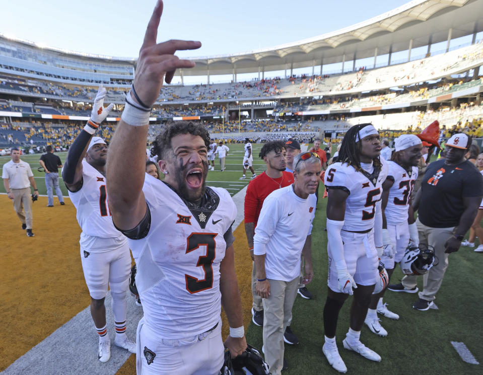 Oklahoma State quarterback Spencer Sanders reacts to fans while walking off the field at McLane Stadium following an NCAA college football game, Saturday, Oct. 1, 2022, in Waco, Texas. Oklahoma State defeated Baylor 36-25. (Rod Aydelotte/Waco Tribune-Herald, via AP)