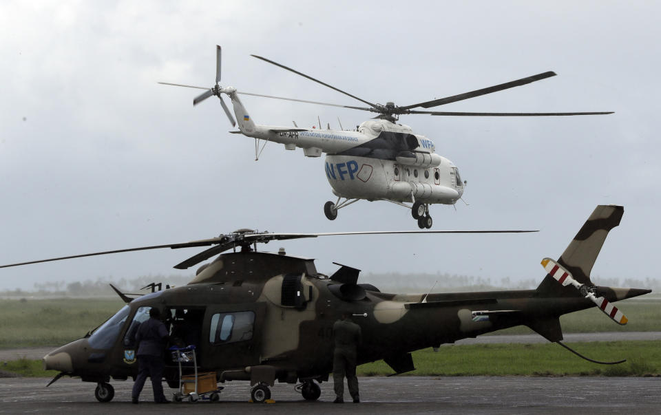 A World Food Programme (WFP) helicopter takes off, in Beira, Mozambique, Friday, March 22, 2019. A week after Cyclone Idai hit coastal Mozambique and swept across the country to Zimbabwe, its death, destruction and flooding continues to grow in southern Africa, making it one of the most destructive natural disasters in the region's recent history. (AP Photo/Themba Hadebe)