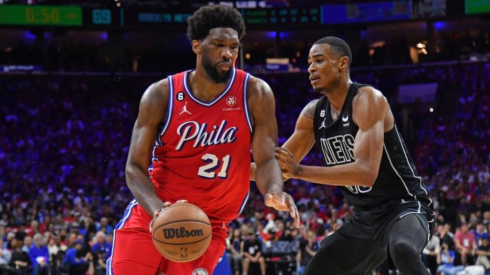 Apr 15, 2023; Philadelphia, Pennsylvania, USA; Philadelphia 76ers center Joel Embiid (21) drives to the basket against Brooklyn Nets center Nic Claxton (33) during the third quarter of game one of the 2023 NBA playoffs at Wells Fargo Center.