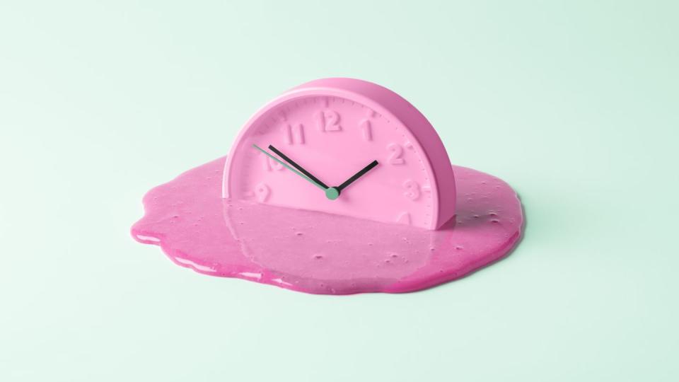 the pink clock melts against the birch background creative concept of time