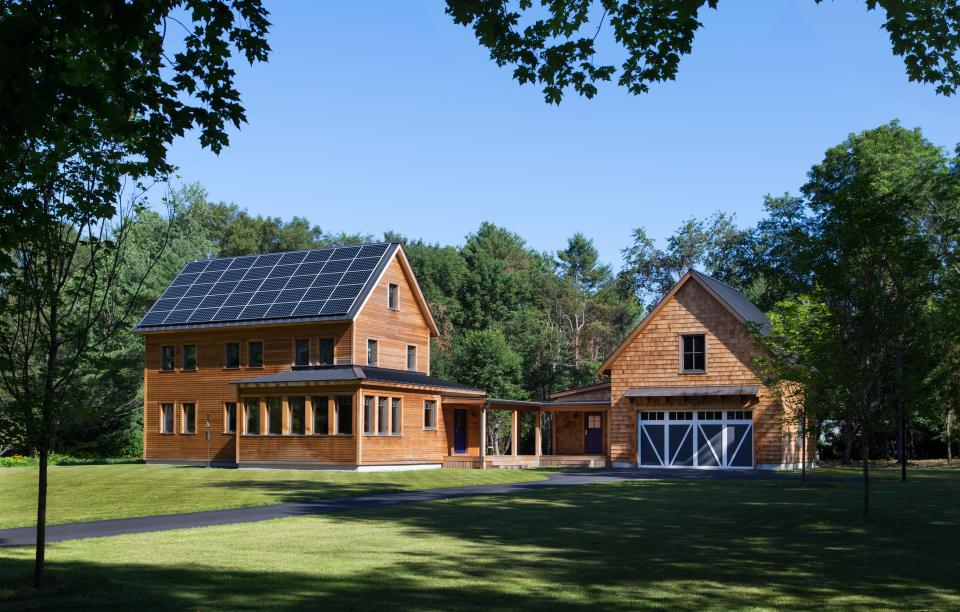 Zero Energy Design created this net-positive farmhouse in Lincoln, Massachusetts, which blends efficiency with tradition. The home uses 70 percent less energy than a code-built house and produces 67 percent more energy than it consumes.