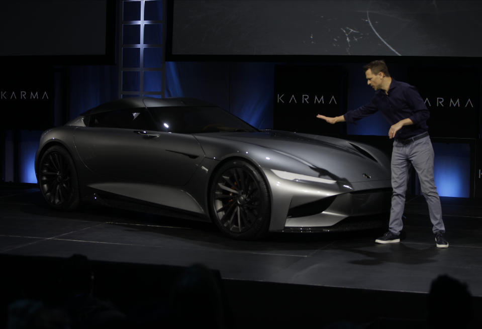 Karma Automotive Andreas Thurner, Vice President for Global Design and Architecture, unveils the Karman Vision SC2 concept vehicle at Automobility LA Auto Show in Los Angeles, Tuesday, Nov. 19, 2019. (AP Photo/Damian Dovarganes)