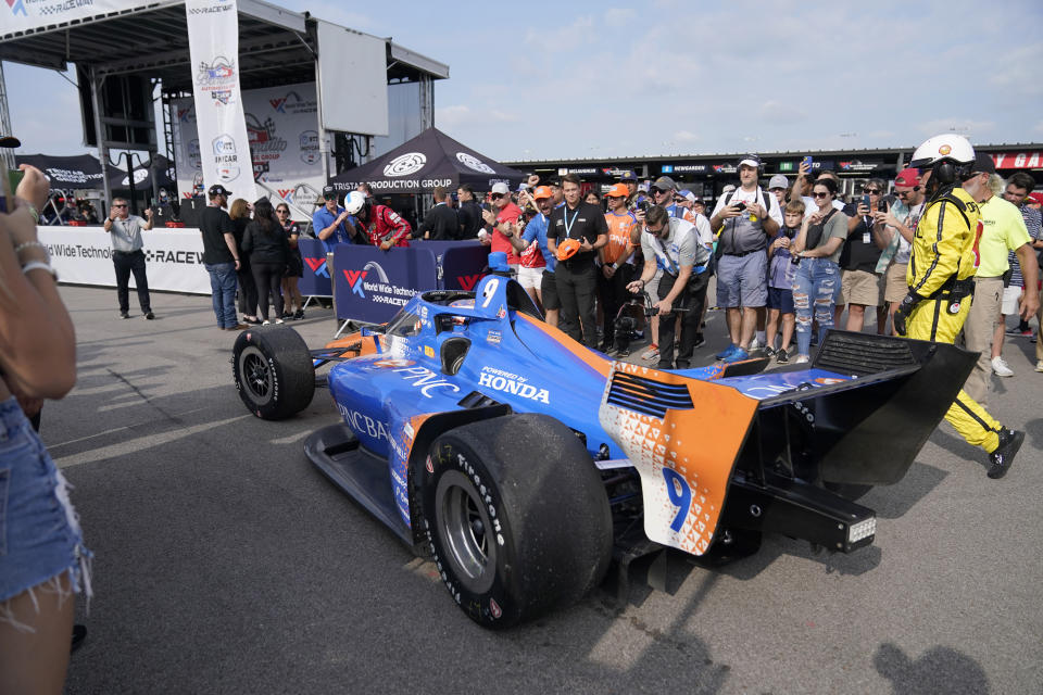 Scott Dixon heads to victory lane after winning an IndyCar auto race at World Wide Technology Raceway, Sunday, Aug. 27, 2023, in Madison, Ill. (AP Photo/Jeff Roberson)