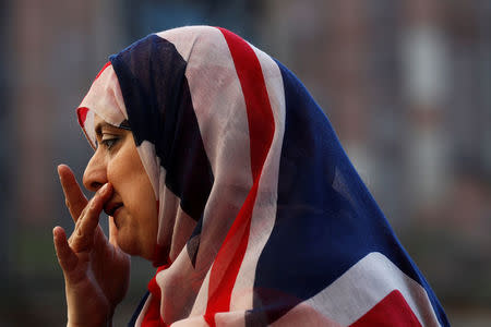 A woman wears a union jack hijab in St Ann's square, in central Manchester, Britain May 26, 2017. REUTERS/Stefan Wermuth