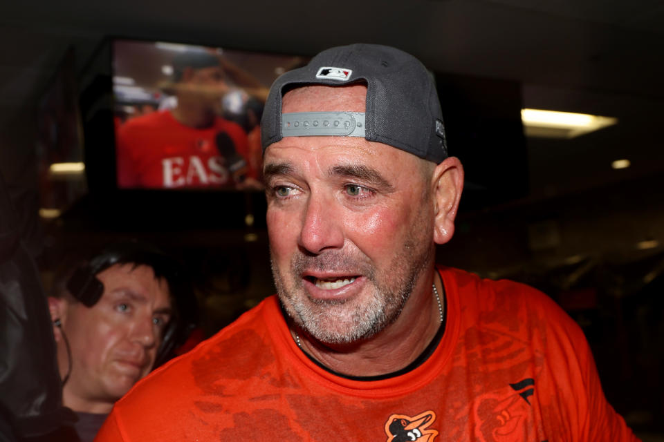BALTIMORE, MARYLAND - SEPTEMBER 28: Manager Brandon Hyde #18 of the Baltimore Orioles celebrates in the locker room after the Orioles defeated the Boston Red Sox to win the the American League East at Oriole Park at Camden Yards on September 28, 2023 in Baltimore, Maryland. (Photo by Rob Carr/Getty Images)