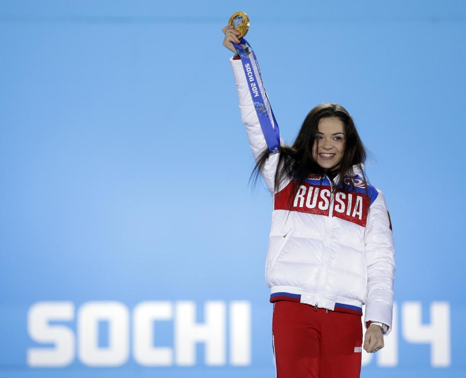 Women's free skate figure skating gold medalist Adelina Sotnikova of Russia celebrates during the medals ceremony at the 2014 Winter Olympics, Friday, Feb. 21, 2014, in Sochi, Russia. (AP Photo/David Goldman)