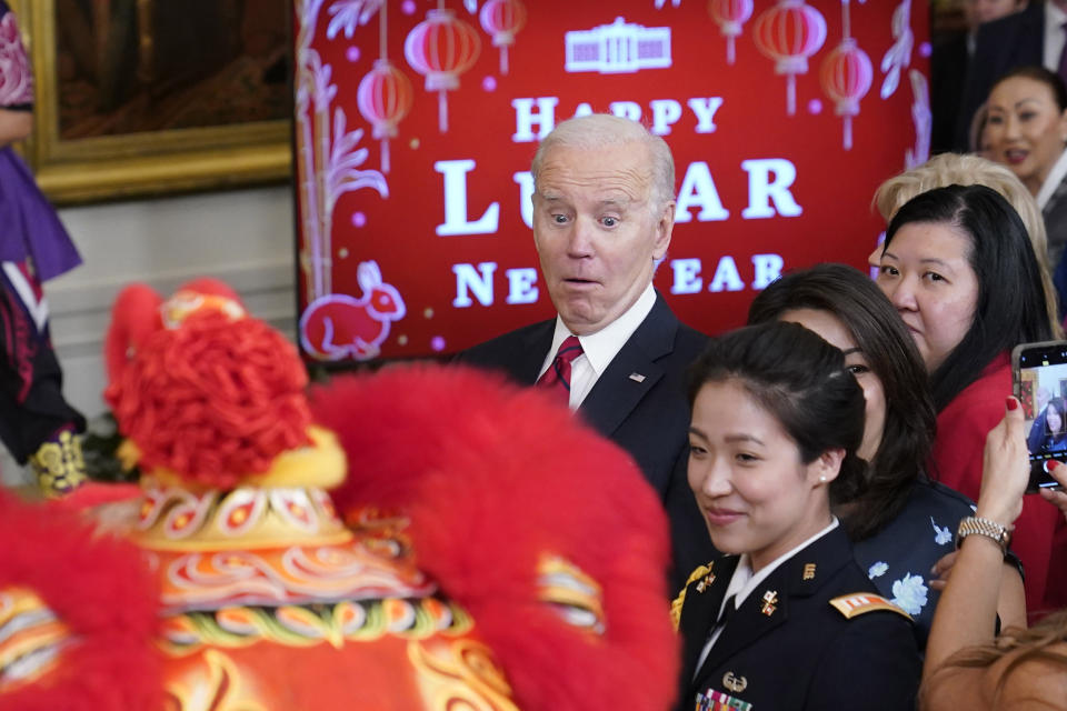 President Joe Biden reacts to a performer during a reception to celebrate the Lunar New Year in the East Room of the White House in Washington, Thursday, Jan. 26, 2023. (AP Photo/Susan Walsh)