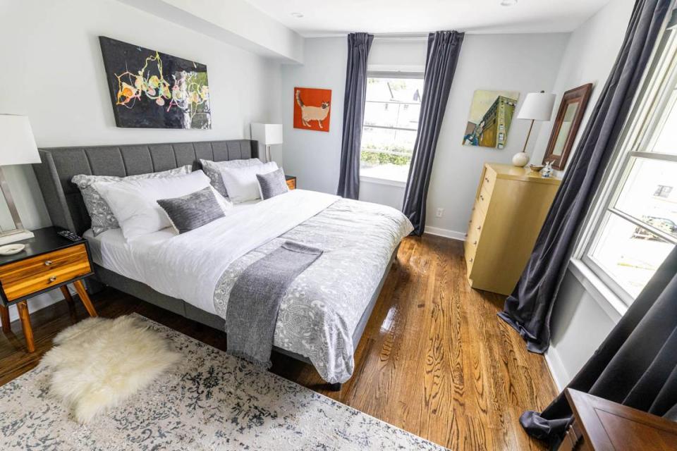 A bedroom at 510 Queens Road features art by Charlotte’s Arthur Brouthers over the bed.