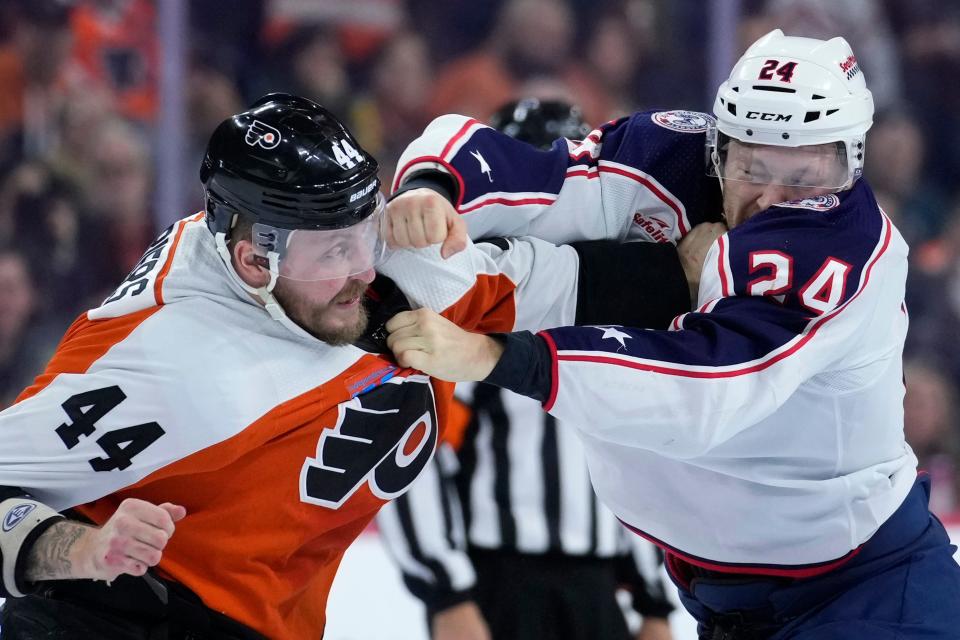 Philadelphia Flyers' Nicolas Deslauriers, left, and Columbus Blue Jackets' Mathieu Olivier fight during the first period of an NHL hockey game, Sunday, Nov. 19, 2023, in Philadelphia. (AP Photo/Matt Slocum)