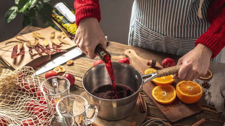red wine pouring into pot