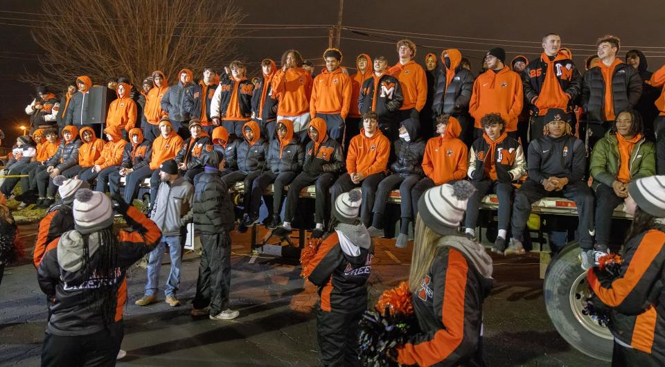 The Massillon Tiger football team and its title are celebrated during a rally Sunday following a parade through downtown.