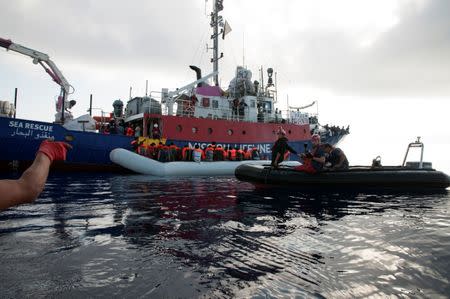 Migrants are seen in a rubber dinghy as they are rescued by the crew of the Mission Lifeline rescue boat in the central Mediterranean Sea, June 21, 2018. Picture taken June 21, 2018. Hermine Poschmann/Misson-Lifeline/Handout via REUTERS