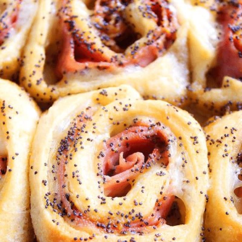 <p>High Heels and Grills</p><p>These Baked Ham and Cheese Rollups make for the best appetizer or dinner recipe! They are a crowd-pleaser every time I make them. Made with crescent dough, smoked ham, Swiss cheese and a sweet mustard glaze.</p><p><strong>Get the recipe: <a href="https://www.highheelsandgrills.com/baked-ham-and-cheese-rollups/" rel="nofollow noopener" target="_blank" data-ylk="slk:Baked Ham and Cheese Rollups;elm:context_link;itc:0;sec:content-canvas" class="link ">Baked Ham and Cheese Rollups</a></strong></p><p><strong>Related: <a href="https://www.yahoo.com/lifestyle/12-time-best-baked-ham-165104504.html" data-ylk="slk:The 12 All-time Best Baked Ham Recipes for Christmas;elm:context_link;itc:0;sec:content-canvas;outcm:mb_qualified_link;_E:mb_qualified_link;ct:story;" class="link  yahoo-link">The 12 All-time Best Baked Ham Recipes for Christmas</a></strong></p>