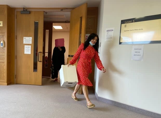 Georgette Young, left, and Angela MacDonald are shown leaving the courtroom at the end of their 6-week fraud trial.  (Erin Pottie/CBC - image credit)