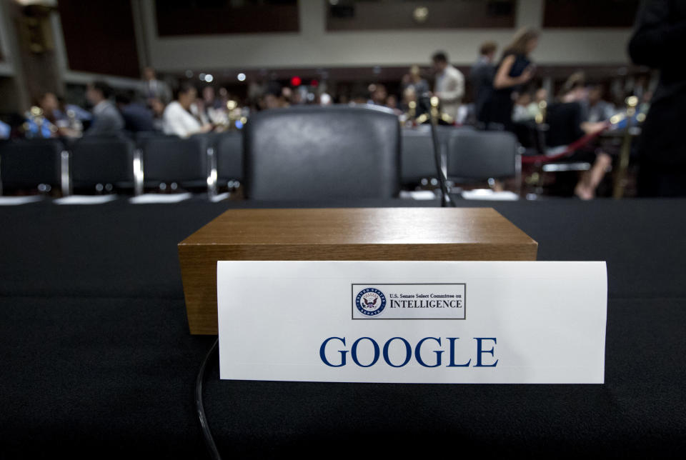 FILE - This Sept. 5, 2018, file photo shows an empty chair reserved for Google's parent Alphabet, which refused to send its top executive, as Facebook COO Sheryl Sandberg and Twitter CEO Jack Dorsey testify before the Senate Intelligence Committee hearing on Capitol Hill in Washington. A year ago, Shoshana Zuboff dropped an intellectual bomb on the technology industry. In a 700-page book, the Harvard scholar skewered tech giants like Facebook and Google with a damning phrase: “surveillance capitalism.” (AP Photo/Jose Luis Magana, File)