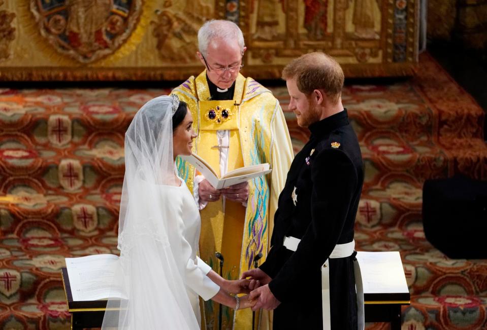 <p>Meghan lanzó la revelación explosiva de que ella y Harry tuvieron una ceremonia secreta con el arzobispo de Canterbury en su patio trasero tres días antes de la ceremonia oficial </p> (AFP via Getty Images)