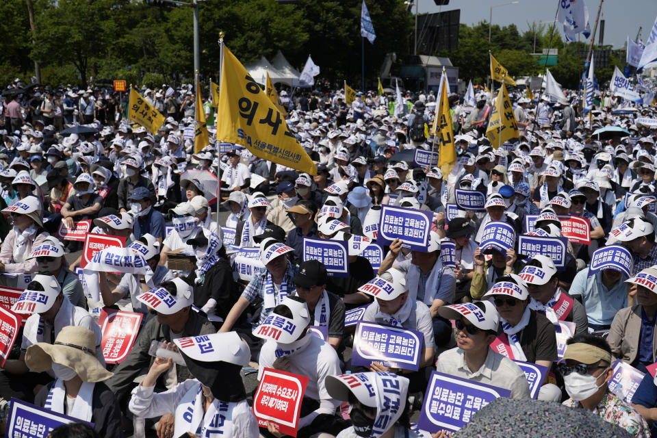 Members of The Korea Medical Association attend at a rally against the government's medical policy in Seoul, South Korea, Tuesday, June 18, 2024. South Korean officials issued return-to-work orders for doctors participating in a one-day walkout Tuesday as part of a protracted strike against government plans to boost medical school admissions, starting next year. (AP Photo/Lee Jin-man)