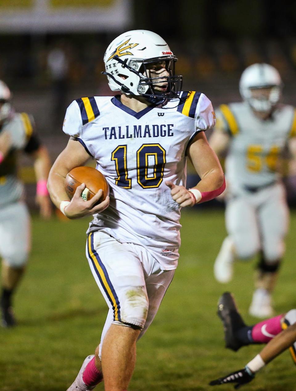 Tallmadge's Zander Hopkins breaks into the open on his way to a touchdonw Oct. 1 at Cuyahoga Falls. The Blue Devils scored a 41-7 at Falls to improve to 5-2 on the season.