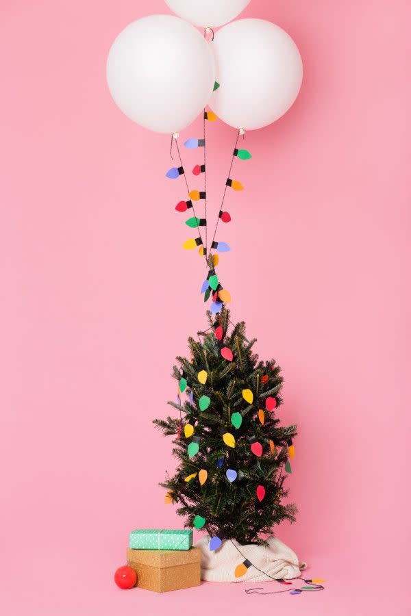 <p>These strings lights brighten up an entire room—even if they are just made of paper. Playful, colorful, and no fire hazard whatsoever—and they're fun to make! Get the tutorial at <a href="http://studiodiy.com/2014/12/16/diy-christmas-light-balloon-garlands/" rel="nofollow noopener" target="_blank" data-ylk="slk:Studio DIY;elm:context_link;itc:0;sec:content-canvas" class="link ">Studio DIY</a>.</p>