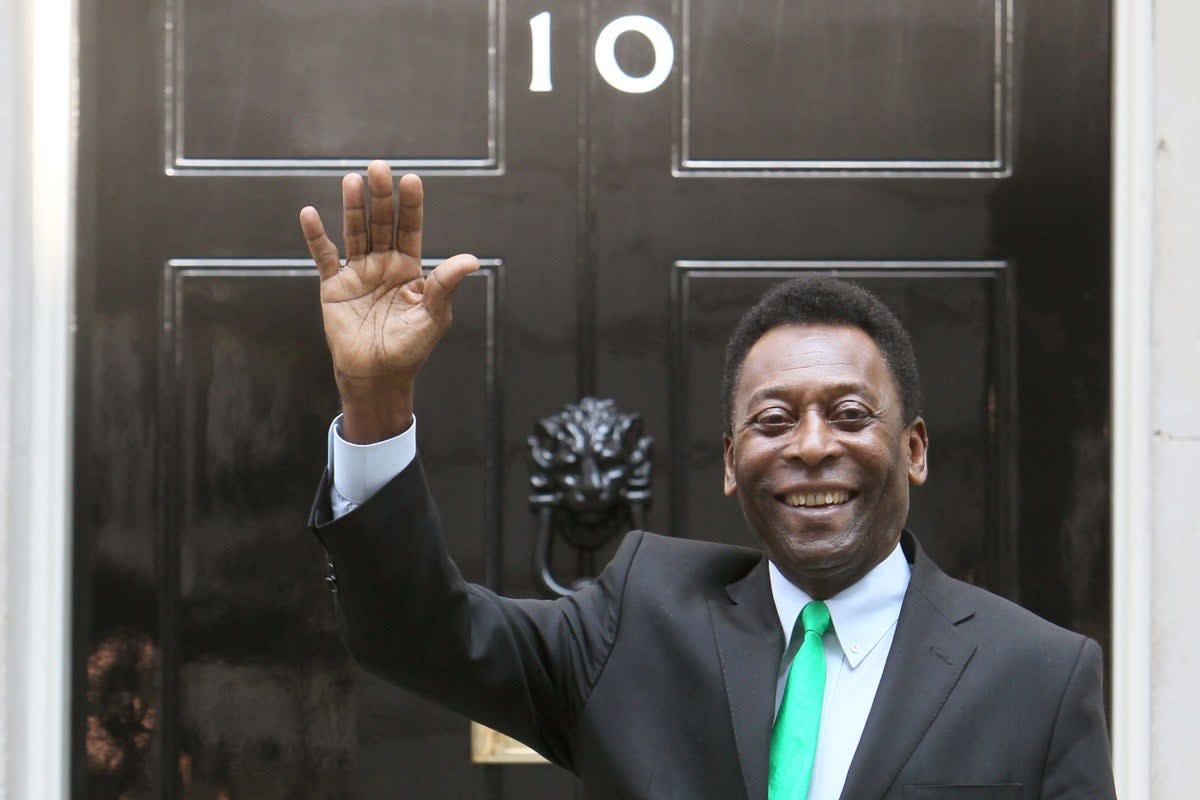 Pele arrives at 10 Downing Street to meet then Prime Minister David Cameron (Dominic Lipinski/PA). (PA Archive)