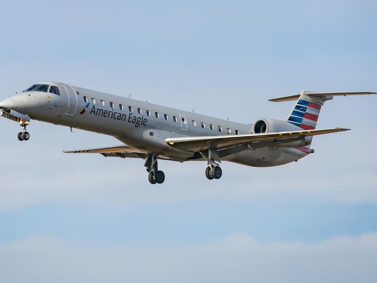 American Airlines Embraer ERJ-145 regional jet aircraft in the sky.