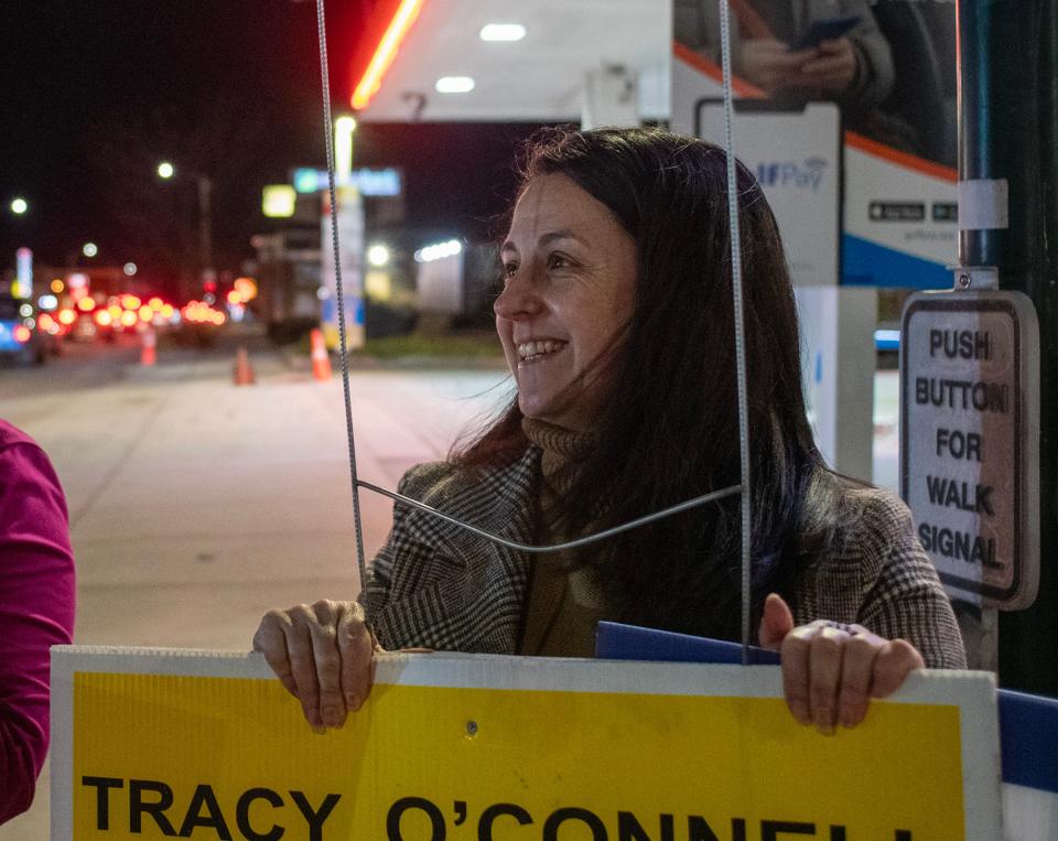 Etel Haxhiaj campaigns at the corner of Pleasant Street and Park Avenue Tuesday.