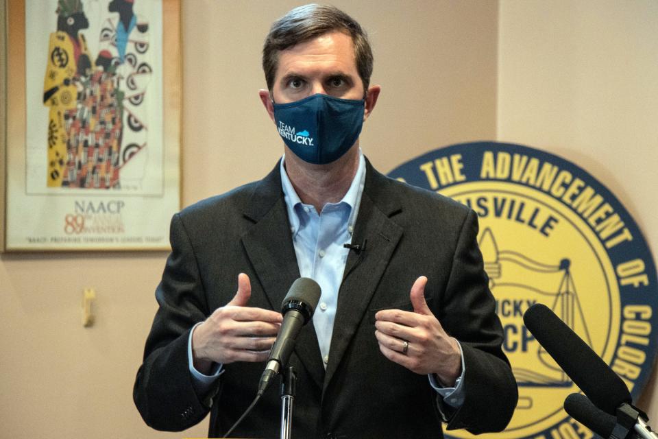 Kentucky Gov. Andy Beshear encourages people attending a gathering at the Louisville NAACP headquarters on Friday to seek vaccinations against COVID-19 and to trust the science behind the shot.