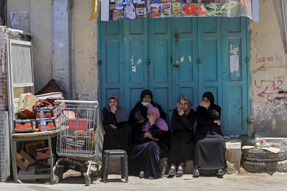 Palestinian mourners react during the funeral of Obaida Jawabreh, who was killed in clashes with Israeli forces, in the West Bank refugee camp of Al-Arrub, Tuesday, May 18, 2021. (AP Photo/Mahmoud Illean)