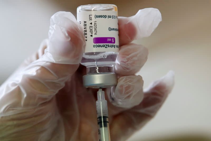 FILE PHOTO: Medical worker prepares a dose of AstraZeneca COVID-19 vaccine at a vaccination center in Ronquieres