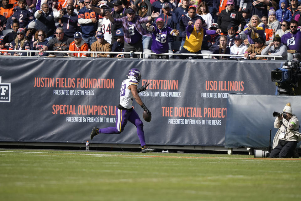 Minnesota Vikings linebacker Jordan Hicks (58) returns a fumble 42-yards for a touchdown during the second half of an NFL football game against the Chicago Bears, Sunday, Oct. 15, 2023, in Chicago. (AP Photo/Charles Rex Arbogast)