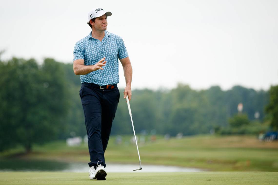 Ricardo Gouveia of Portugal waves to fans after making a putt for birdie on the 18th hole Thursday. Gouveia was part of a strong international presence atop the leaderboard.