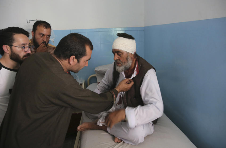 A wounded man receives treatment at a hospital after an explosion in Kabul, Afghanistan, Wednesday, Aug. 7, 2019. A suicide car bomber targeted the police headquarters in a minority Shiite neighborhood in western Kabul on Wednesday, setting off a huge explosion that wounded dozens of people, Afghan officials said. The Taliban claimed responsibility for the bombing. (AP Photo/Rafiq Maqbool)