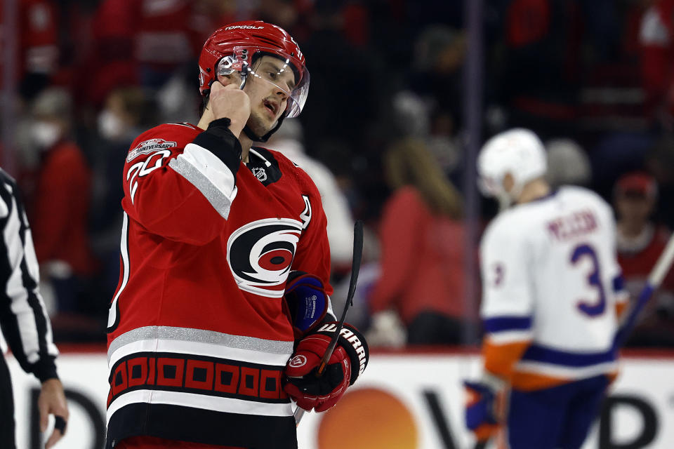 Carolina Hurricanes' Sebastian Aho (20) starts to take off his helmet following the Hurricane' loss to the New York Islanders in Game 5 of an NHL hockey Stanley Cup first-round playoff series in Raleigh, N.C., Tuesday, April 25, 2023. (AP Photo/Karl B DeBlaker)