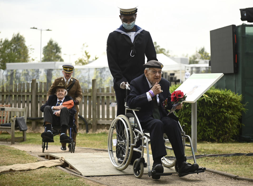 Veterans arrive for the national service of remembrance marking the 75th anniversary of V-J Day at the National Memorial Arboretum in Alrewas, England, Saturday Aug. 15, 2020. Following the surrender of the Nazis on May 8, 1945, V-E Day, Allied troops carried on fighting the Japanese until an armistice was declared on Aug. 15, 1945. (Oli Scarff/PA via AP)