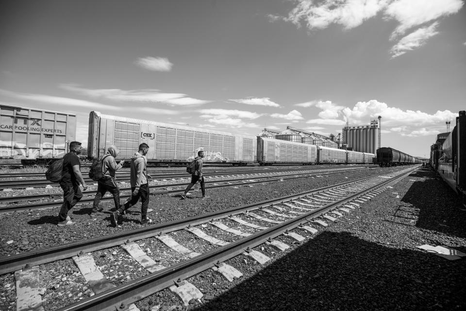 Migrants arrive at a rail yard in Chihuahua City on Sept. 23, 2023, looking for a train to board to the border city of Ciudad Juárez.