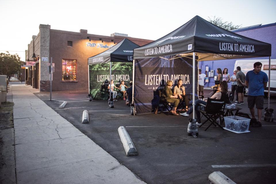 People are interviewed&nbsp;in tents in Tucson, Arizona.