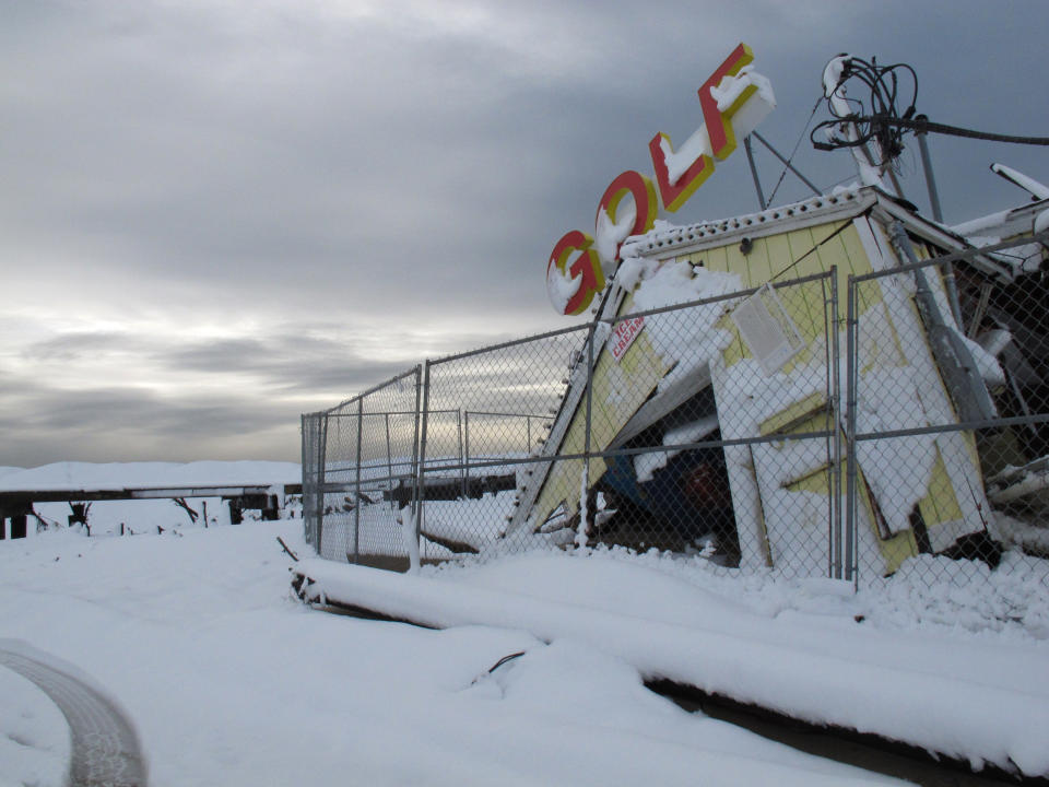 The remains of a mini-golf course destroyed by Superstorm Sandy is seen at the boardwalk Point Pleasnt Beach, N.J., Thursday morning Nov. 8. 2012. Emergency dunes built beyond the boardwalk in Point Pleasant Beach N.J., succeeded in keeping the ocean at bay during Wednesday's nor'easter (AP Photo/Wayne Parry)