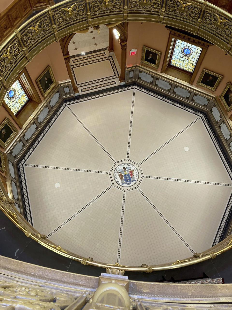 The rotunda at New Jersey's statehouse, along with new lighting, has been spruced up with a new coat of paint to match the way the building looked more than 100 years ago, Wednesday March 22, 2023,, in Trenton, N.J. The building has been reopened and reoccupied by the governor's and other executive staff after a nearly six year, $300-million renovation. (AP Photo/Mike Catalini)